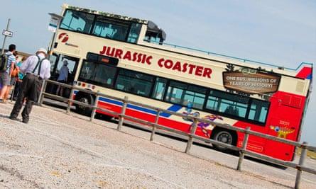 The open-topped bus collects day-trippers at sunny Portland Bill, ready for the scenic return journey to Weymouth.