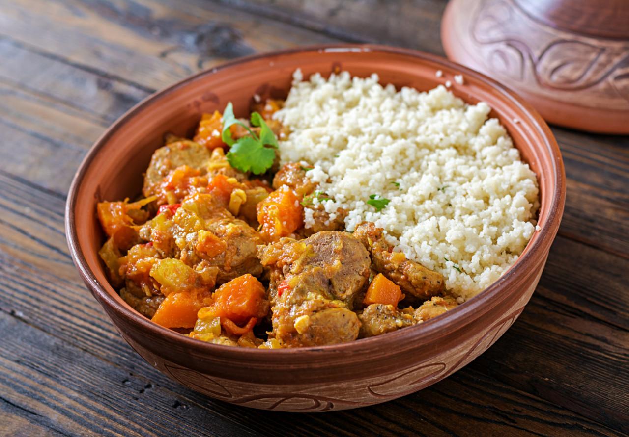 traditional tajine dishes couscous fresh salad rustic wooden table